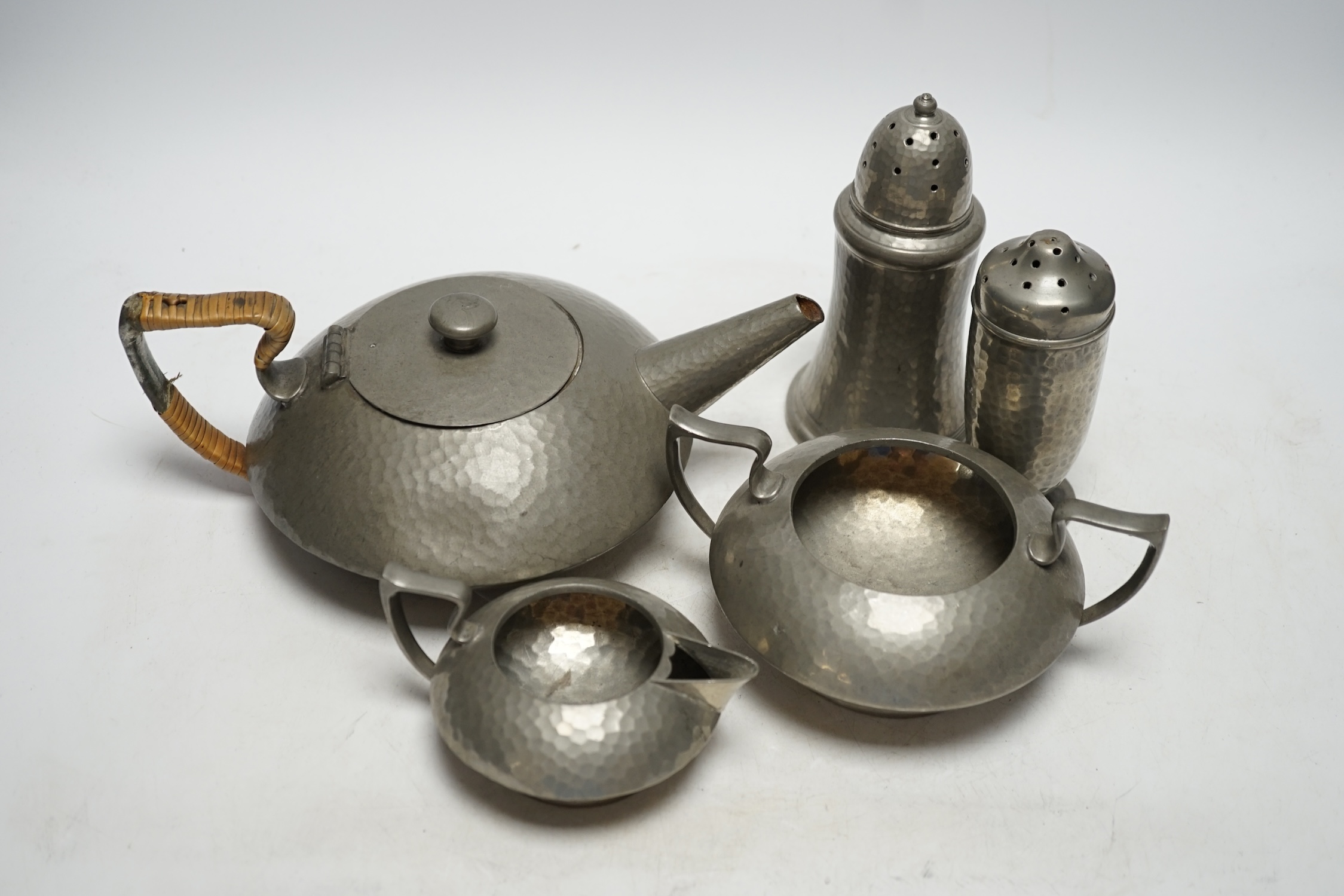 A Hutton Sheffield English Pewter tea set comprising of a teapot, 8cm high, jug and sugar bowl, together with salt and pepper shakers by other makers